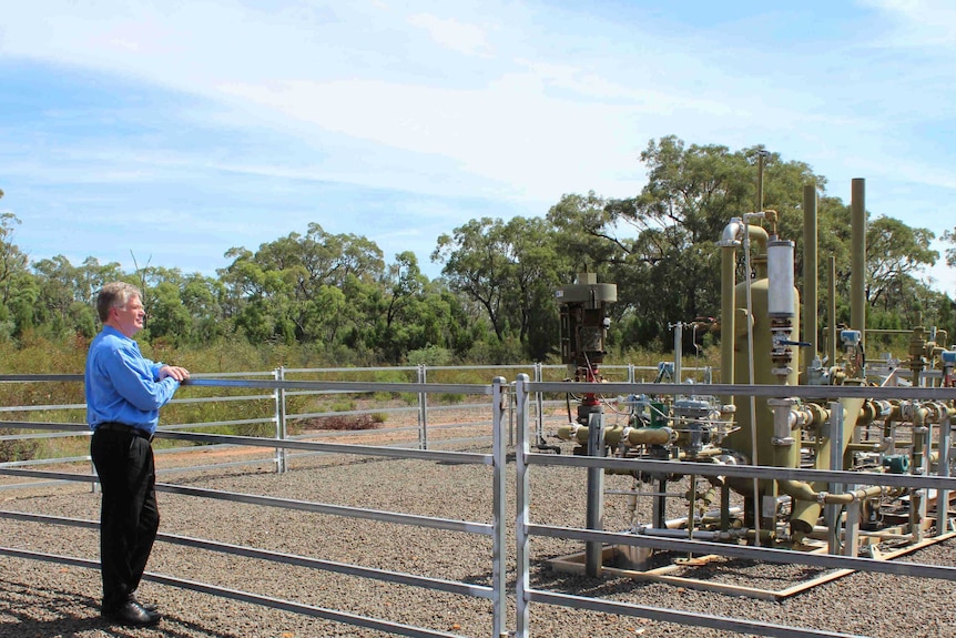 Santos's General Manager Energy NSW, Peter Mitchley, at a pilot well in the Pilliga.