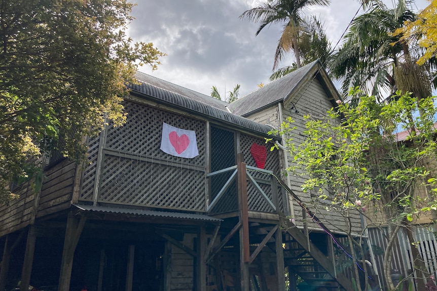 elevated timber home with a love heart hanging 