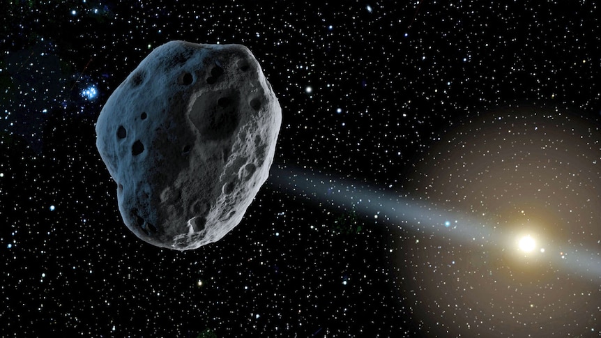 A generic image of a large asteroid floating through space, with a sun in the background.