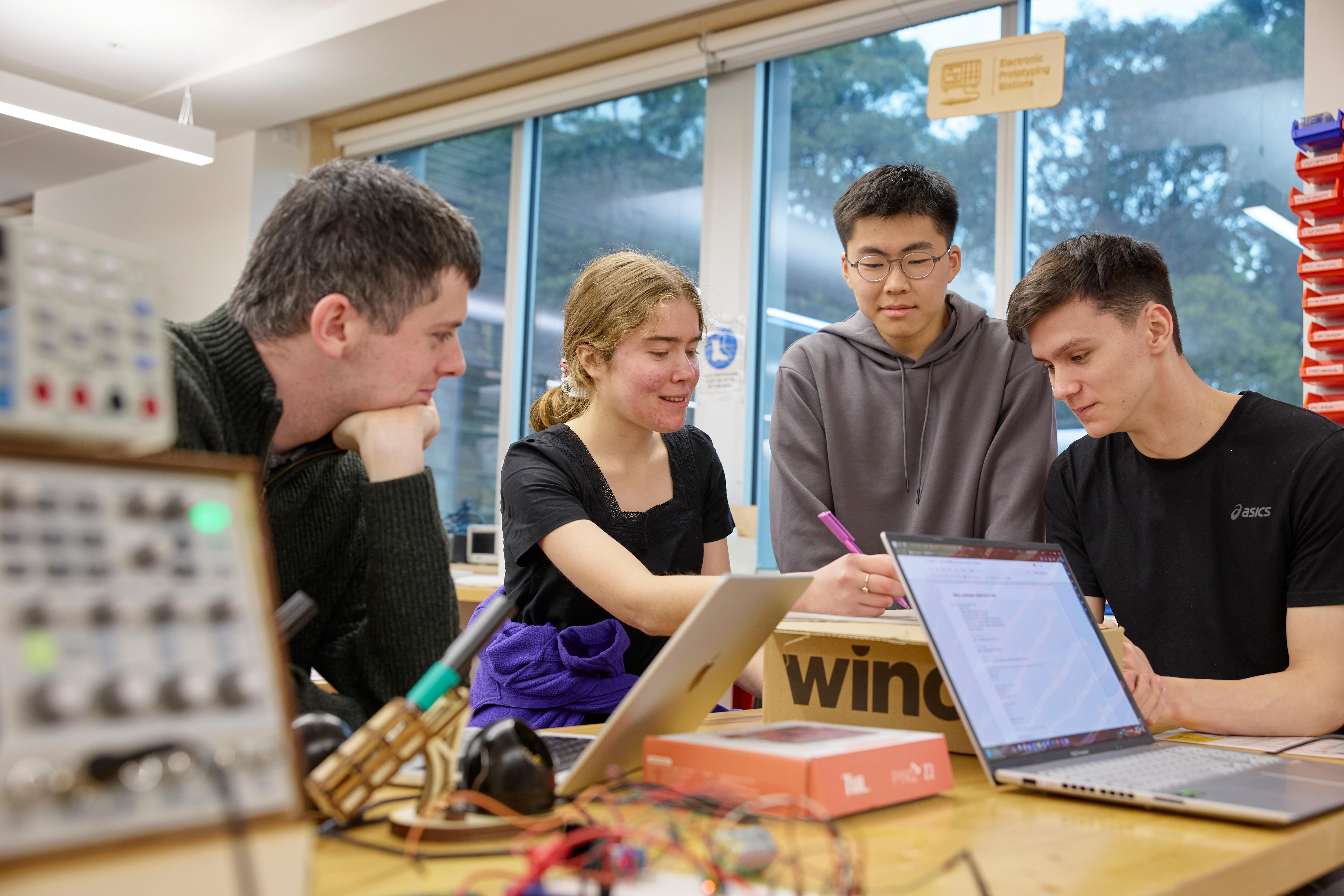 A group of four university students.