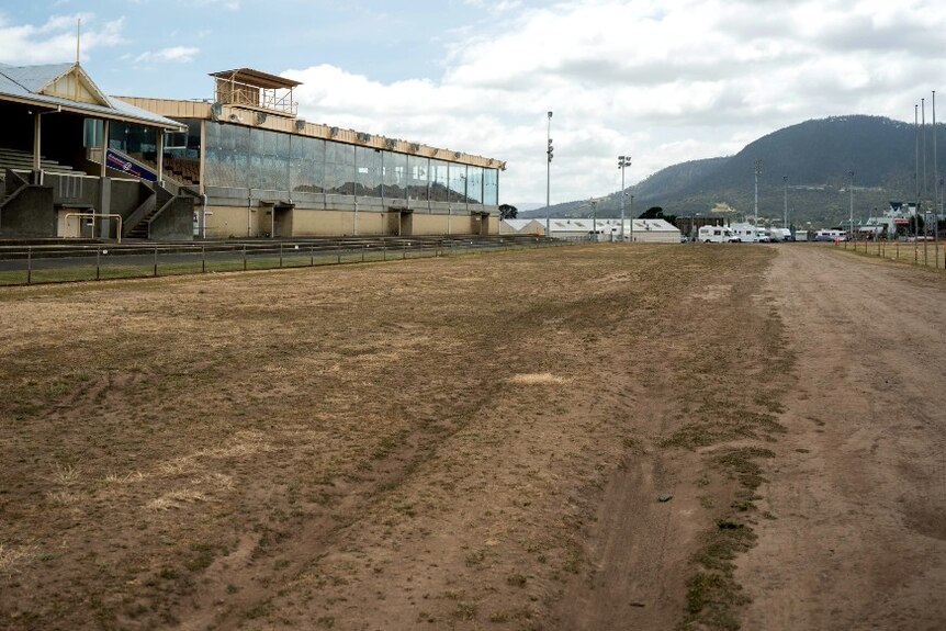 Sandy track in front of a grandstand
