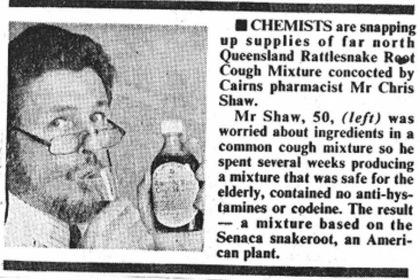 Черно-белая газета с изображением бородатого мужчины в очках, держащего бутылку и пьющего из чашки.