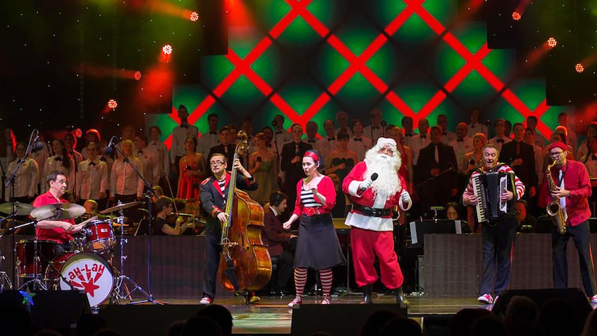 Santa and a band sing carols on the Brisbane Riverstage