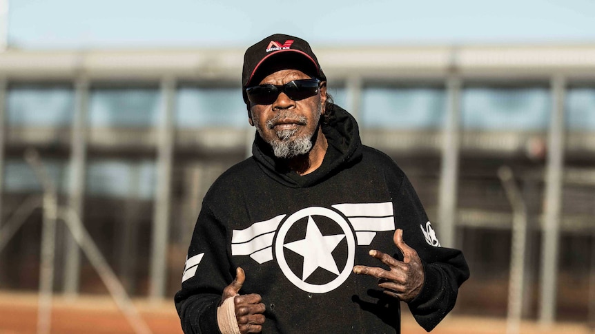 An Aboriginal man giving the thumbs up after being released from jail.