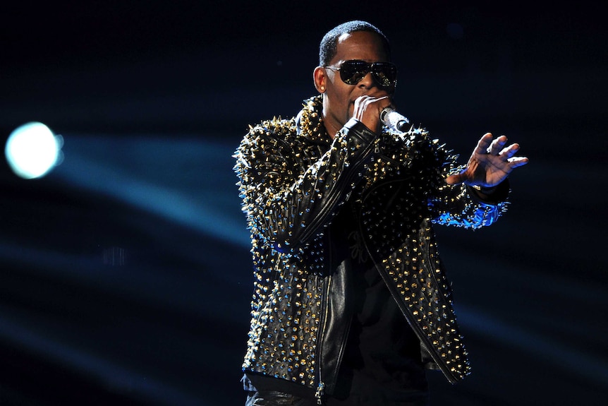 R Kelly performs on stage