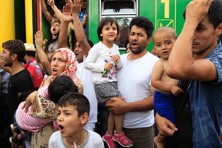 Migrants protest at the railway station in the town of Bicske, Hungary