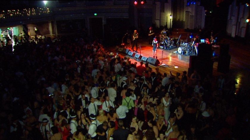 The band rocks the NYE crowd at the gangster's ball at Brisbane City Hall.