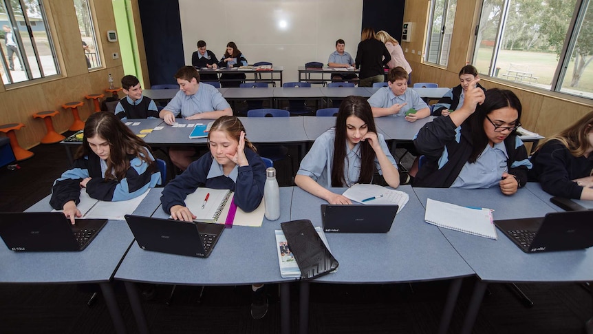 Student on laptops in the off-grid classroom.