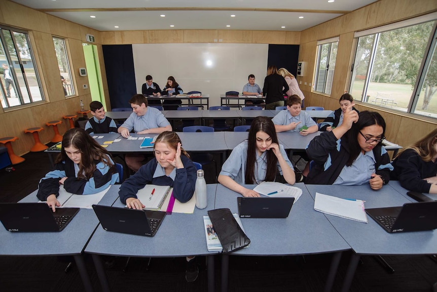 Student on laptops in the off-grid classroom.