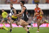 Magpies captain Scott Pendlebury on the ball against Gold Coast at Carrara.