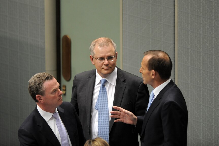 Christopher Pyne, Scott Morrison and Tony Abbott discuss strategy in Parliament House