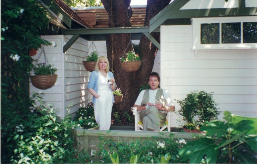 Terence and Christine Hodson sit in a garden.