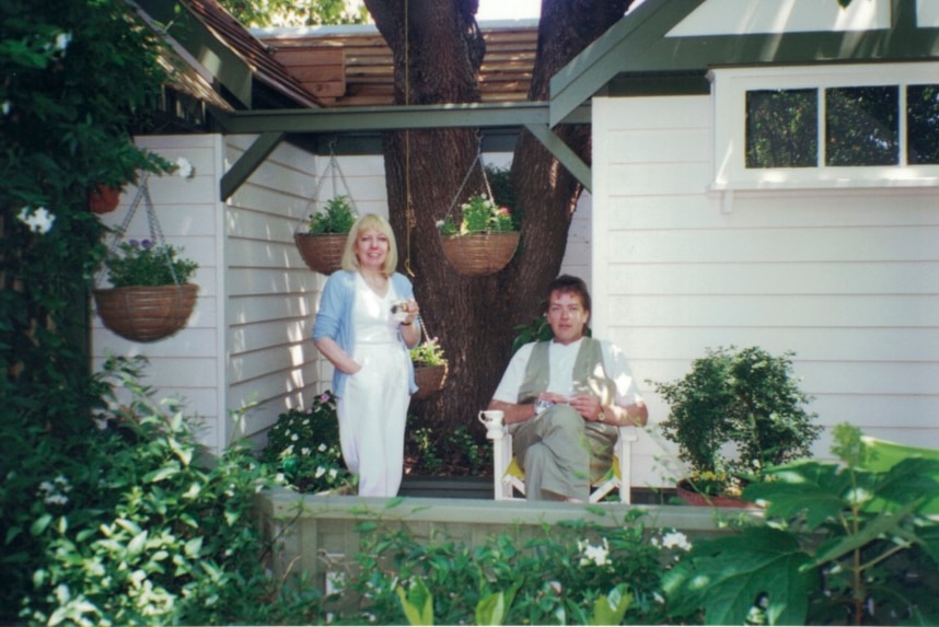 Terence and Christine Hodson sit in a garden.