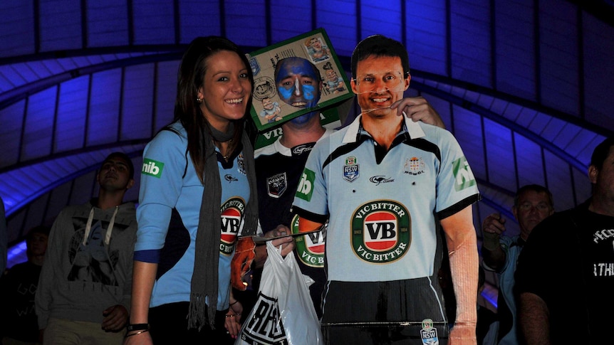 Blues supporters with a cardboard figure of Laurie Daley