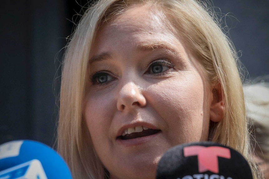 Virginia Roberts Giuffre, a sexual assault victim, speaks during a press conference outside a Manhattan court.