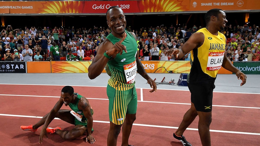 South Africa's Akani Simbine (C) celebrates 100m win over Henricho Bruintjies (L) and Yohan Blake.