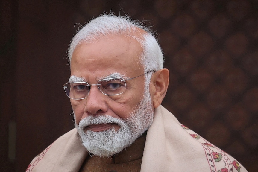India's Prime Minister Narendra Modi looks at the camera in a close up image of his head.