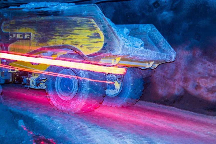 Mining truck carrying gold-bearing ore underground.