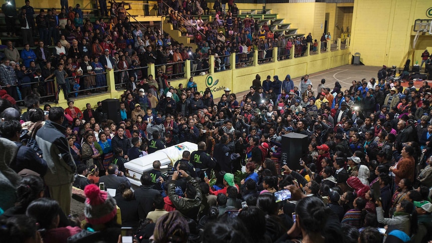 Hundreds gather at a football stadium for the wake of Claudia Gomez Gonzalez