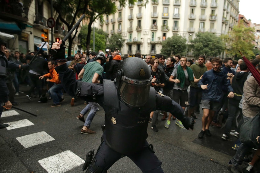 Police used batons and fired rubber bullets at protesters during the Catalonia referendum