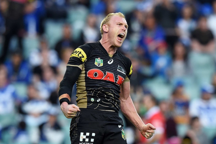 Peter Wallace celebrates a try against Canterbury