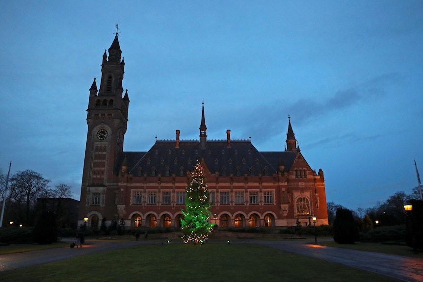  General view of the International Court of Justice (ICJ) in The Hague, Netherlands a large historical building lit up with a tu