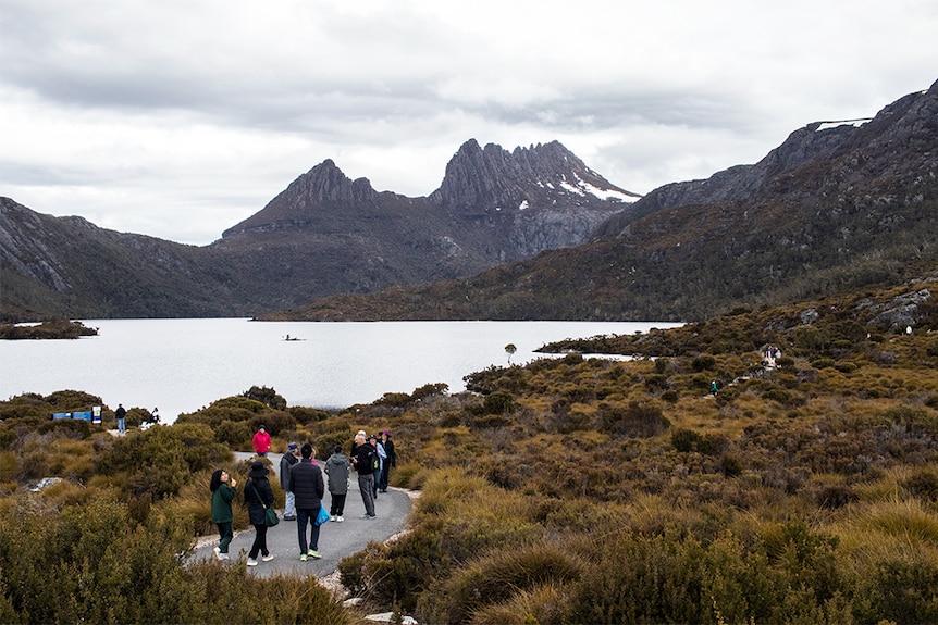 Tourists at Cradle Mountain in spring