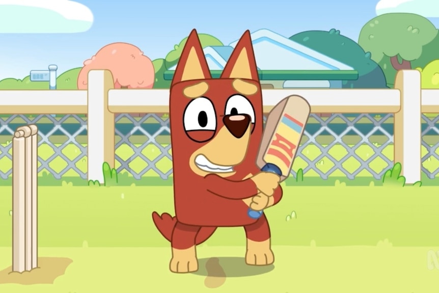 Rusty smiles while holidng his bat 