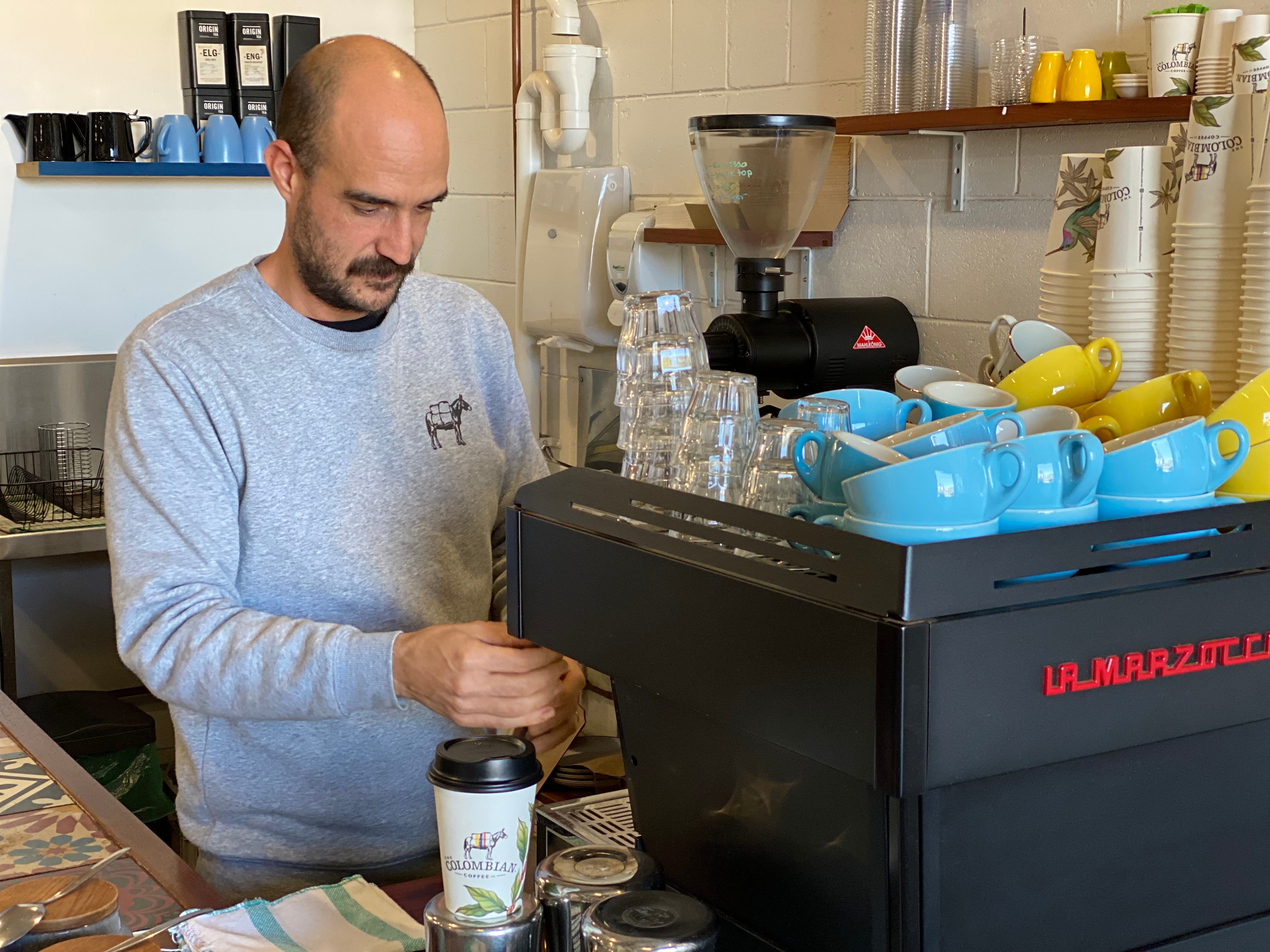 Man making coffee at machine