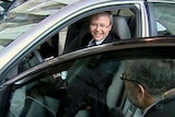 Prime Minister Kevin Rudd sits in a hybrid car while visiting Toyota in Nagoya, Japan