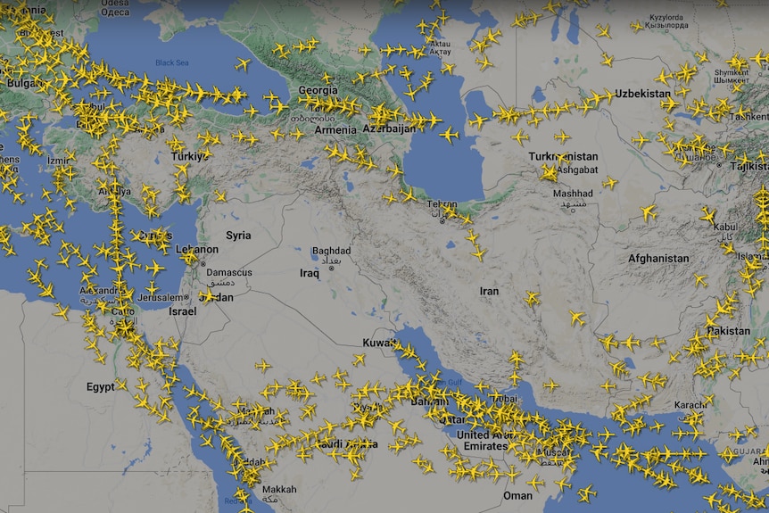 A map view showing tiny yellow planes avoiding the middle east region.
