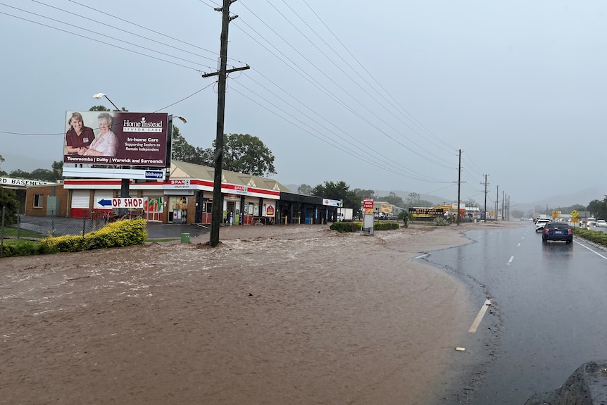 Water over the road at Withcott at the bottom of the Toowoomba Range