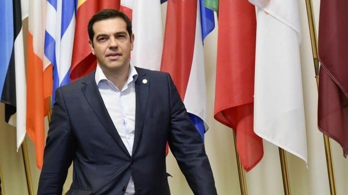 Greek prime minister Alexis Tsipras arrives to speak to journalists