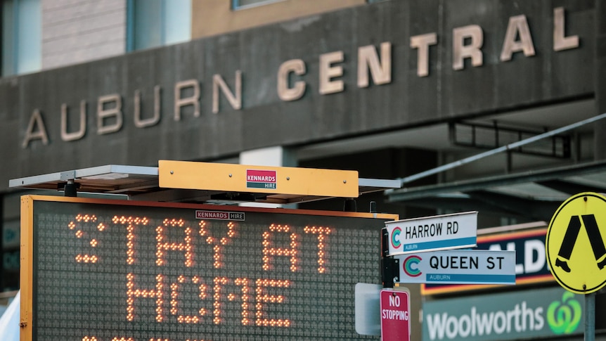 a neon sign outside as shopping centre