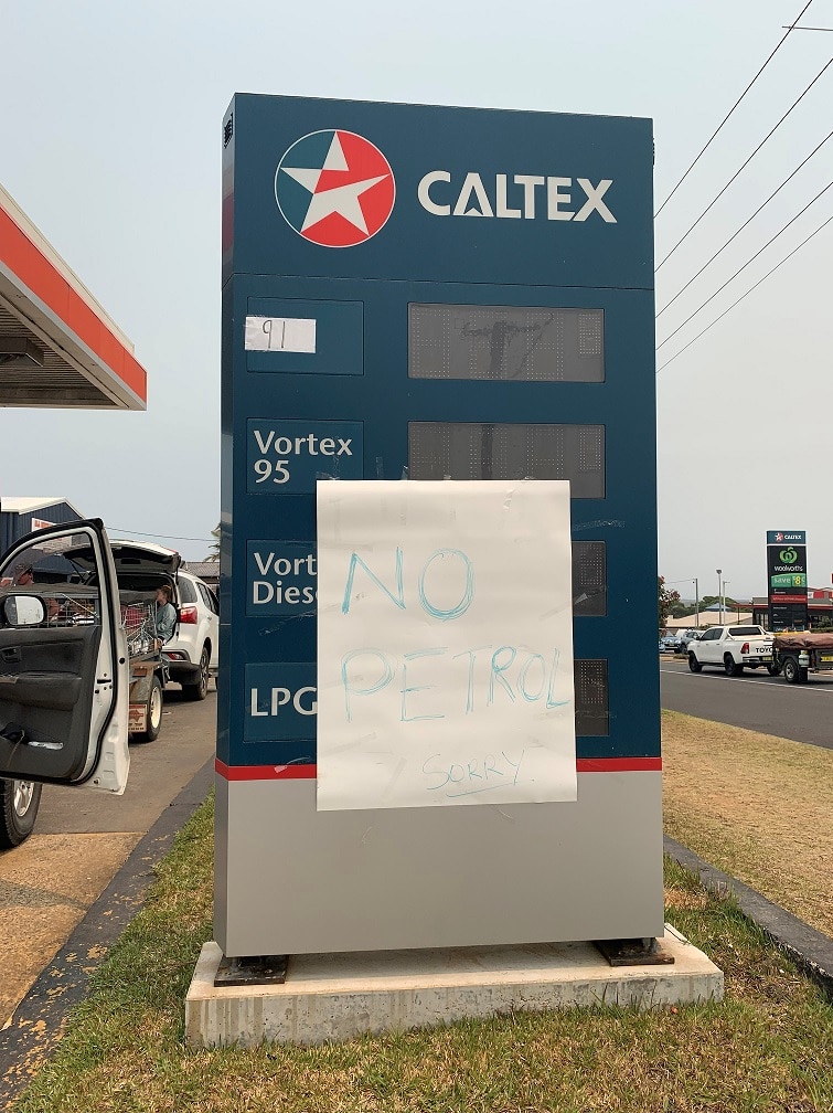 A sign saying 'no petrol' in front of a service station