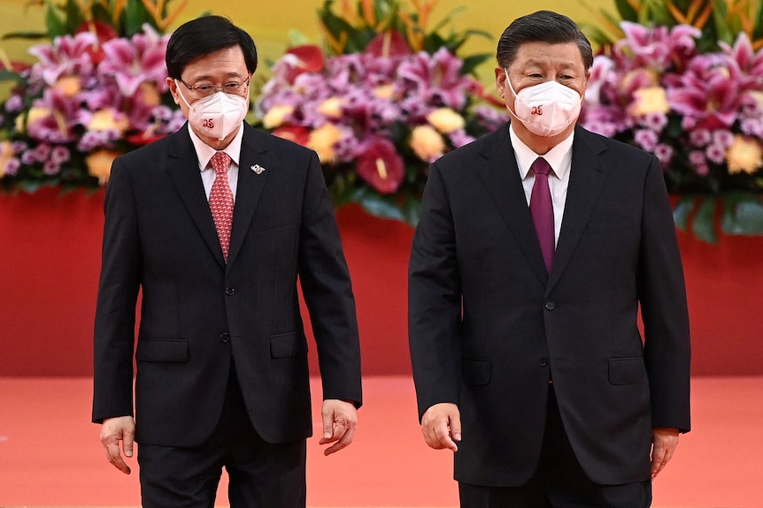 John Lee and Xi Jinping, both wearing masks. 