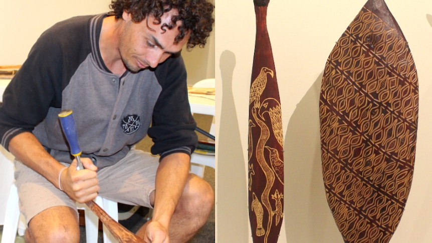 Ngemba carver Andrew Snelgar working on a wooden club.