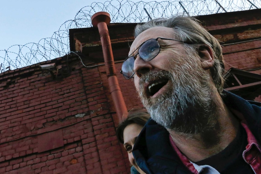 Colin Russell reacts as he is released on bail from prison