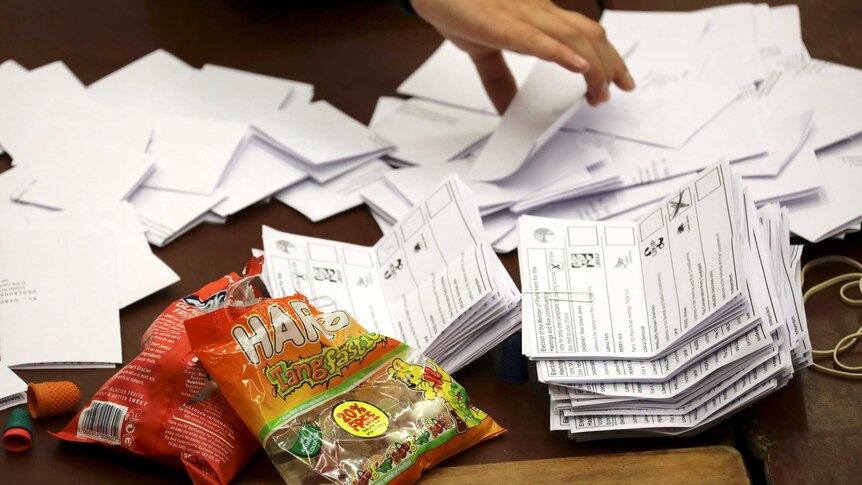 Workers tallied the ballots and snacked on British Haribo Tangfastic candies and Chewits.