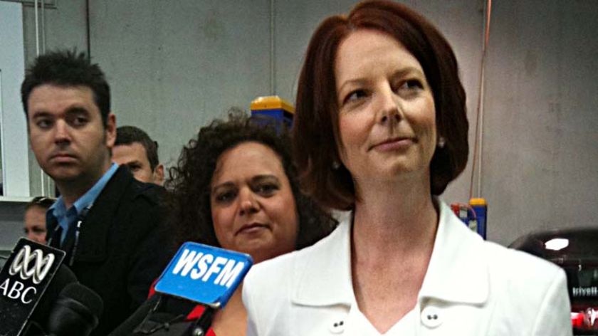 Prime Minister Julia Gillard listens to a question from a reporter