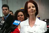 Prime Minister Julia Gillard listens to a question from a reporter