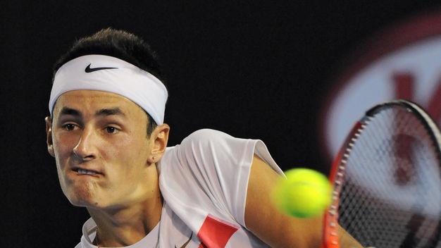 Tomic goes down in five