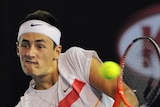 Tomic goes down in five