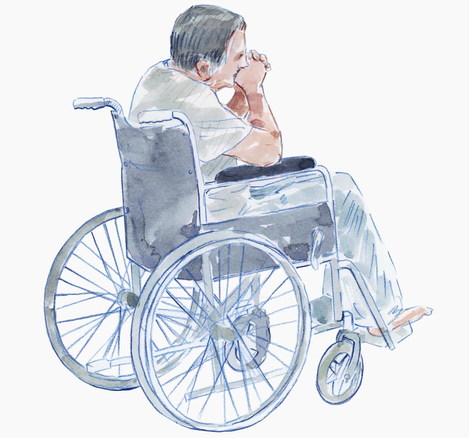 An elderly man sits in wheelchair looking contemplative.