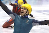 Steven Bradbury raises his arms in triumph after winning gold at the 2002 Winter Olympics