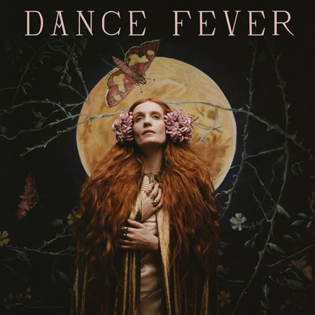 Florence Welch looks up with her hands on her chest. Red hair flows down her front. A moon and butterfly is behind her.