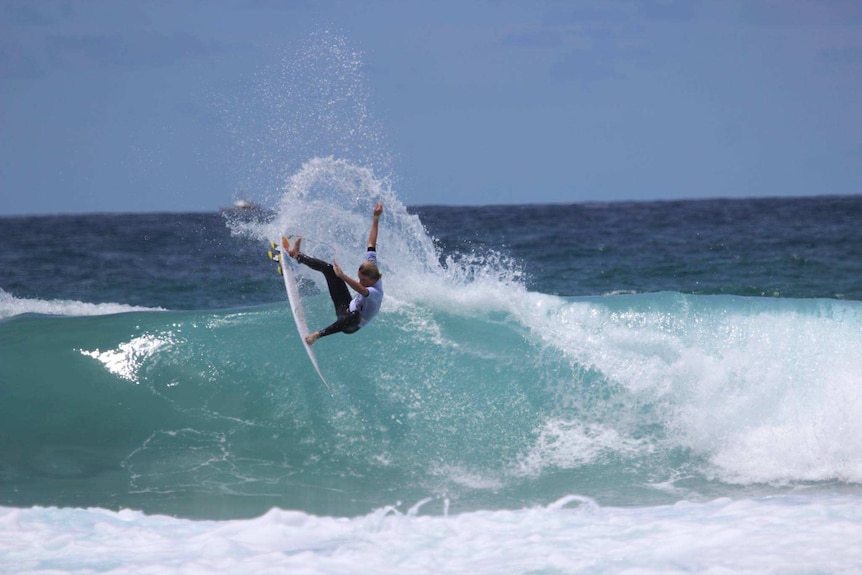 Luke Rice pulls a big turn during the Junior World Surfing Championships in Kiama