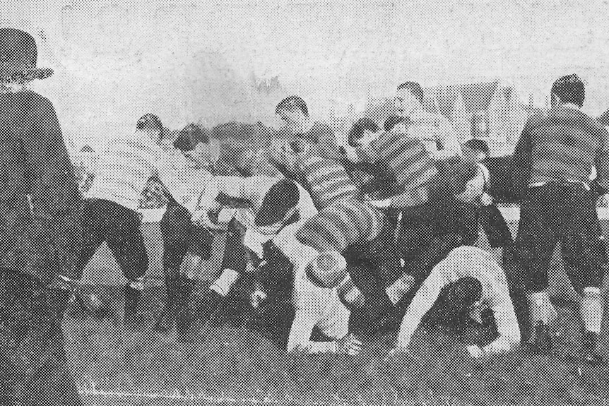 The earliest photo on record of West Harbour Rugby Club in action, playing a Sydney University team more than a century ago.