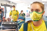 Long-distance runner Isobel Batt-Doyle at the Darwin Airport, wearing a face mask.