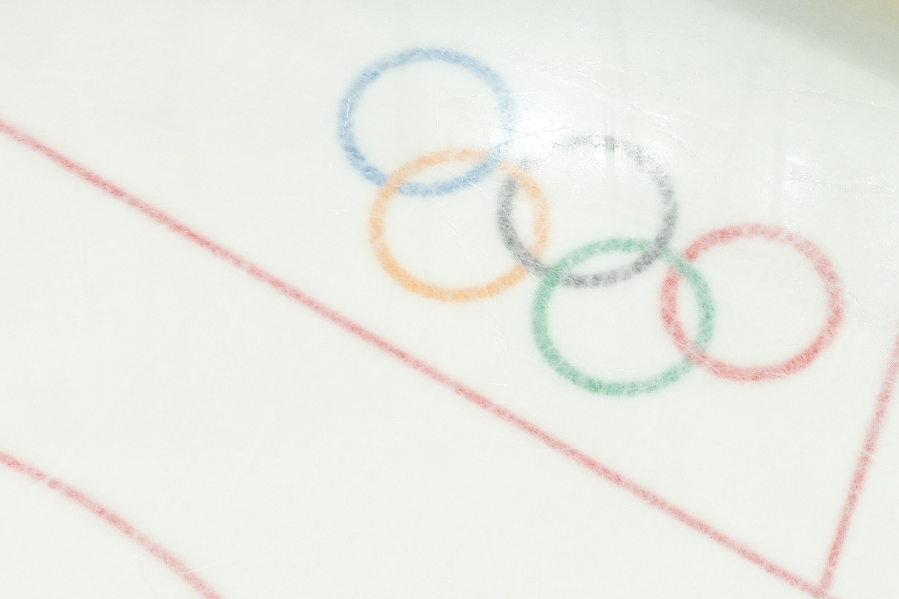 An overhead shot of the Olympic rings on ice